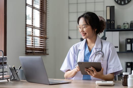 Doctor pointing at digital computer tablet screen, sharing health tests laboratory results to serious female patient or explaining medical insurance benefits at meeting in clinic.