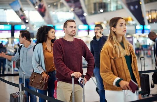 Travel, queue and wait with man in airport for vacation, international trip and tourism. Holiday, luggage and customs with passenger in line for airline ticket, departure and flight transportation.
