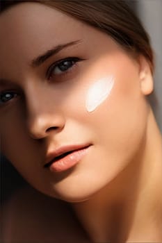 Beauty, suntan spf and skincare cosmetics model face portrait, woman with moisturising cream, sunscreen product or sun tan lotion on her cheek, luxury facial and skin care ad