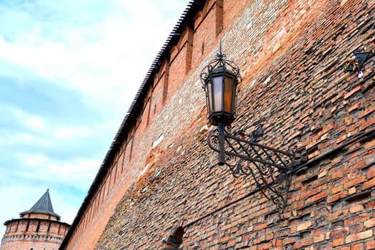 Metal lantern in vintage style on the fortress wall