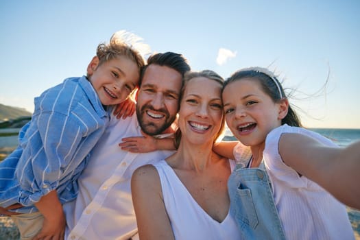 Parents, kids and beach selfie with smile, hug or care in summer sunshine on outdoor holiday. Father, mother and young children with photography, profile picture or together with bond on social media.