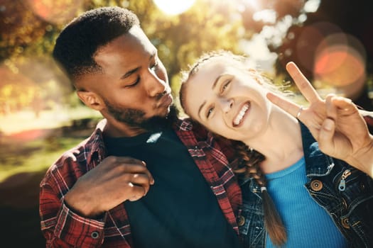 Couple, selfie peace sign and portrait smile outdoors, enjoying fun time and bonding at park. Interracial, love romance and black man and woman with v hand emoji for taking pictures for happy memory