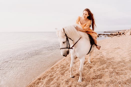 A white horse and a woman in a dress stand on a beach, with the sky and sea creating a picturesque backdrop for the scene