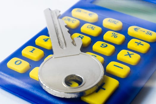 The calculator and a home key macro closeup, white background