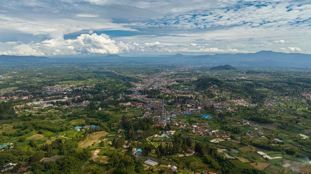 Berastagi town among farmlands in the beautiful Karo highlands. Sumatra. Indonesia.