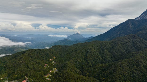 Tropical mountain range and mountain slopes with rainforest. Borneo, Sabah, Malaysia.