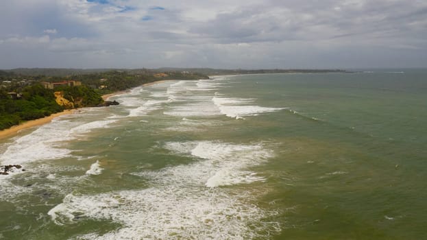 Aerial view of Seascape with tropical sandy beach and blue ocean.