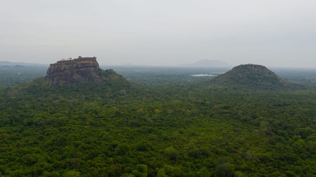 Sigiriya Rock and Pidurangala rock near Dambulla in Sri Lanka. Green rainforest and jungle.