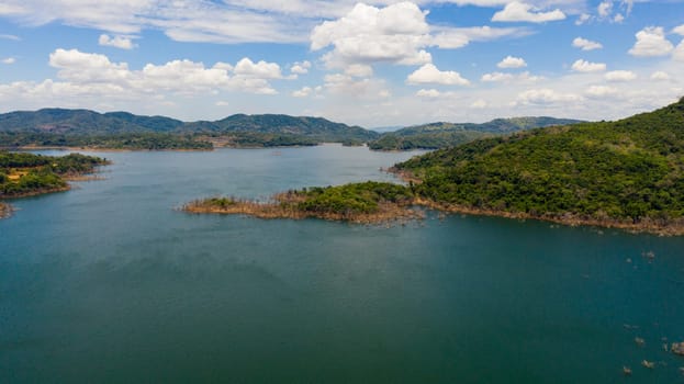 Lake among the mountains covered with jungle. Kalu Ganga Reservoir, Sri Lanka.