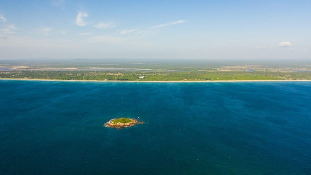 Aerial view of sea coast of the island of Sri Lanka with a sandy beach. Nilaveli Beach, Trincomalee.