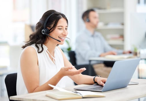 Woman, callcenter and laptop with phone call and smile, happy conversation with communication and contact us. CRM, customer service and help with female consultant at desk, positivity and telecom.