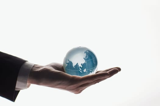 businessman holding a globe, earth, planet with a map. Isolated on white background.
