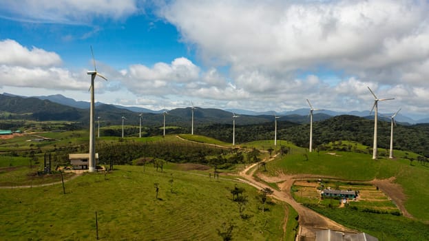 Wind turbines producing clean sustainable energy, clean energy future. Wind power plant. Ambewela, Sri Lanka.