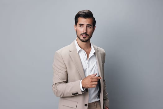 shirt man portrait beard happy isolated suit businessman smiling corporate beige business handsome smile crossed confident young office copyspace fashion standing