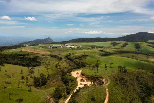 Pastures and meadows with green grass on the hills in the mountainous province. Ambewela, Nuwara Eliya, Sri Lanka.