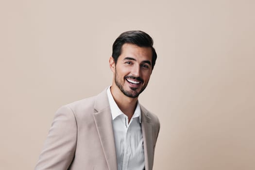 man person suit smiling happy model confident portrait copyspace beige studio isolated shirt businessman formal job grey white handsome business male