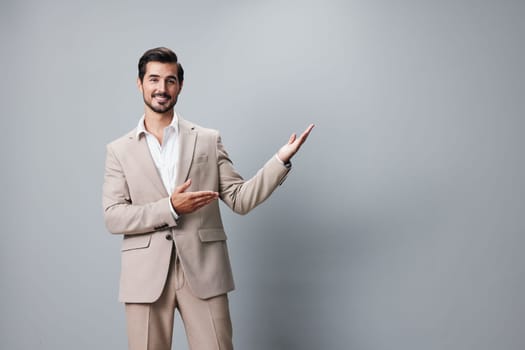 man crossed smiling suit background portrait fashion beige studio arm businessman standing grey job business handsome young copyspace happy model attractive