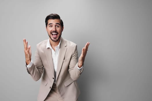 happy man isolated arm up business businessman standing suit fashion job eyeglass beige sexy confident victory hand success smile white winner