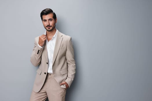 handsome man business businessman eyeglass beige model suit corporate posing happy background portrait entrepreneur smiling attractive formal isolated tie copyspace occupation