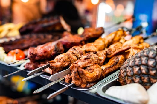 Barbecue grill meat at street food market. Fresh cooking delicious bbq beef at traditional fair