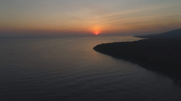 aerial view sunrise over ocean. seascape colorful sunrise over sea at tropical resort