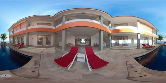 vr 360 swimming pool in luxury hotel with sun beds by sea. tropical resort with pool. Travel concept.