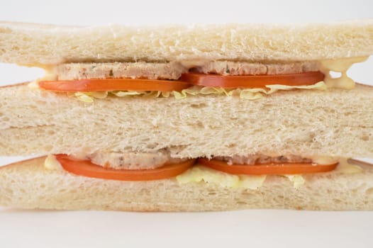 Meat sandwich with fresh tomato and cabbage