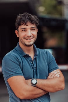 Portrait of a young successful entrepreneur in front of the company. High quality photo