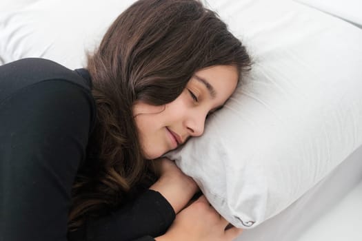 teenage girl in bed. resting, good night sleep concept