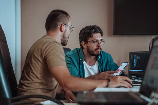 Programmers engrossed in deep collaboration, diligently working together to solve complex problems and develop innovative mobile applications with seamless functionality