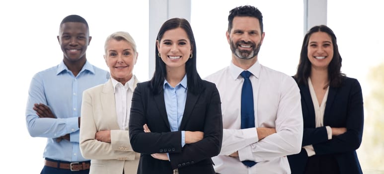 Portrait, management and arms crossed with a business team standing together in their professional office. Collaboration, teamwork and leadership with a group of colleagues looking confident at work.