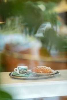 coffee and brioche pastry croissant italian breakfast at the bar, unhealthy lifestyle.