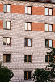The windows of a tall house at sunset