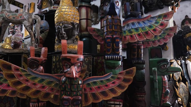 Hindu and Buddhist wooden carving. souvenir shop selling souvenirs and handicrafts of Bali at famous Ubud Market, Indonesia