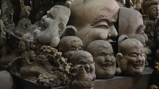 Face mask souvenirs, Hindu and Buddhist wooden carving. souvenir shop selling souvenirs and handicrafts of Bali at famous Ubud Market, Indonesia