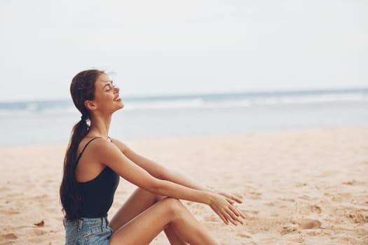 body woman sea vacation bali travel hair beach freedom alone natural fashion smile coast beautiful female sand white sitting young nature