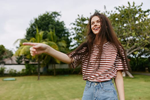 woman lifestyle park nature meditation beautiful health long freedom joy female t-shirt hair happiness wellness carefree natural young relax care summer smiling walk