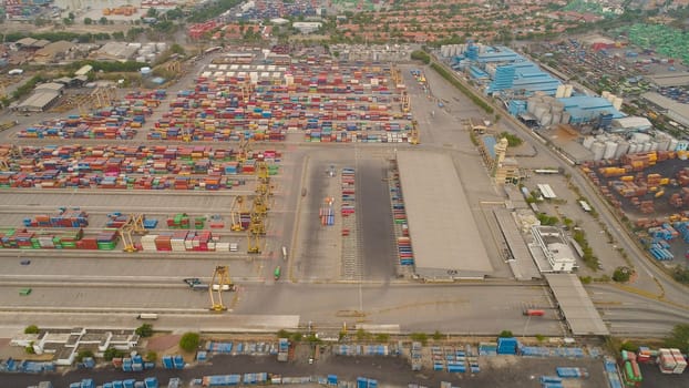aerial view container terminal port surabaya. cargo industrial port with containers, crane. Tanjung Perak, indonesia. logistic import export and transport industry