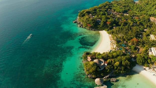 White sandy beach with tourists and hotels in Boracay Island, Philippines, aerial view. Seascape with beach on tropical island. Summer and travel vacation concept.