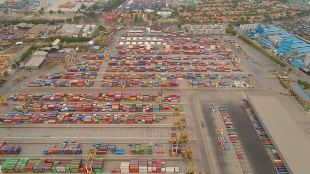 aerial view container terminal port surabaya. cargo industrial port with containers, crane. Tanjung Perak, indonesia. logistic import export and transport industry