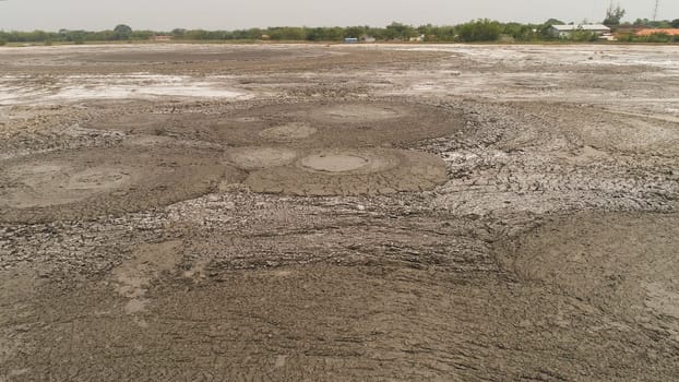 Mud volcano bledug kuwu. aerial view volcanic plateau with geothermal activity and geysers, Indonesia java. aerial view volcanic landscape