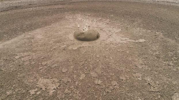 Mud volcano bledug kuwu. aerial view volcanic plateau with geothermal activity and geysers, Indonesia java. aerial view volcanic landscape