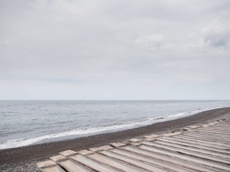 Production of sea salt in the Bali,Indonesia. Salt crystallizes out of the ground in salt farm, filled with natural salt from the sea.