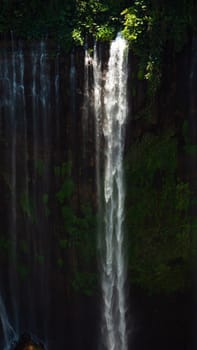 waterfall coban sewu in Java, indonesia. waterfall in tropical forest by drone Tumpak Sewu