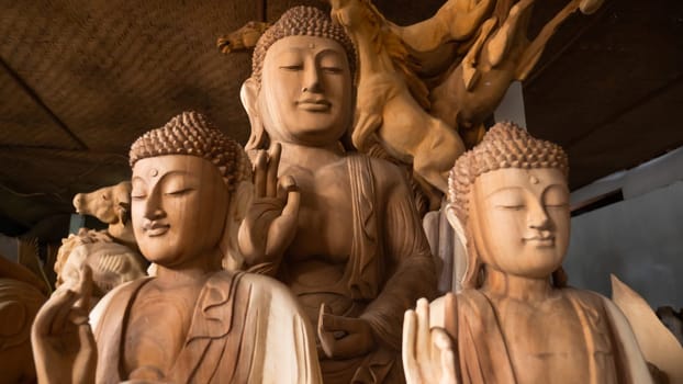 Hindu and Buddhist wooden carving. souvenir shop selling souvenirs and handicrafts of Bali at famous Ubud Market, Indonesia