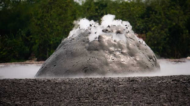 mud volcano with bursting bubble bledug kuwu. volcanic plateau with geothermal activity and geysers, slow motion Indonesia java. volcanic landscape