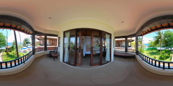 vr 360 view from the balcony of luxury hotel on sea. bedroom interior with large bed in luxury hotel. travel concept.
