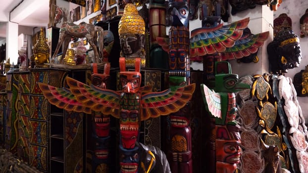 Hindu and Buddhist wooden carving. souvenir shop selling souvenirs and handicrafts of Bali at famous Ubud Market, Indonesia
