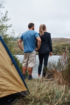 Relax, camping and nature with couple at lake for adventure, vacation and health trip. Journey, peace and lifestyle with man and woman thinking in countryside for travel, summer or freedom together.