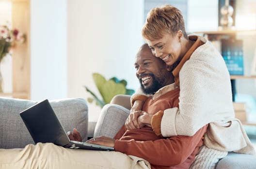 Black couple, laptop and hug together with technology at home, watching a film or video call with 5g network. Black man, black woman and spending quality time on sofa, connection and streaming online.